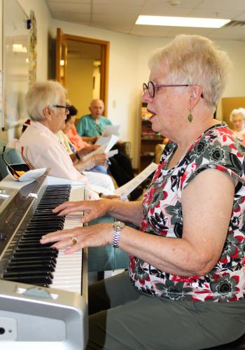 People sing along at Oakwood Village in Madison. The facility has music programs to help people living with memory loss. 