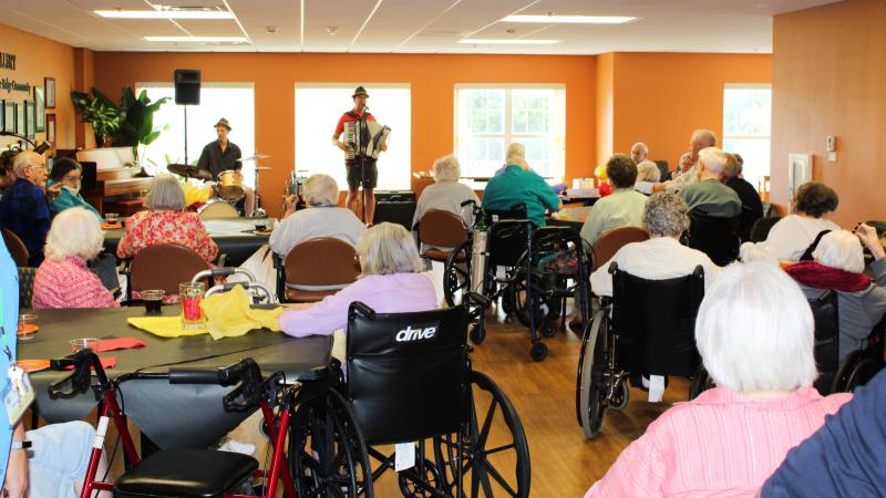 People sing along at Oakwood Village in Madison. The facility has music programs to help people living with memory loss.