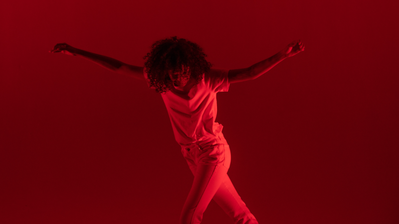 a dancer in red lighting